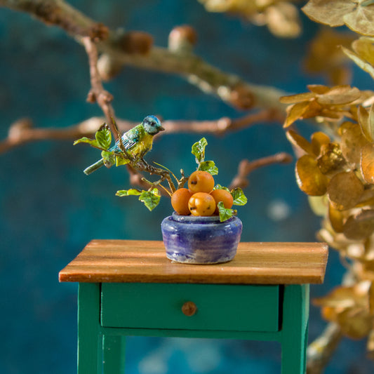 Miniature blue tit on a vase with apricots for a dollhouse, scale 1:12. - Rina Vellichor